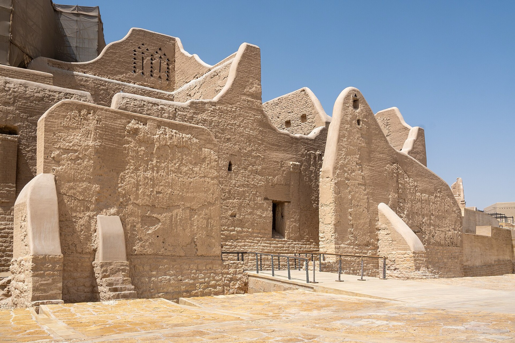 Mud‑brick walls of At‑Turaif in Diriyah under a clear sky